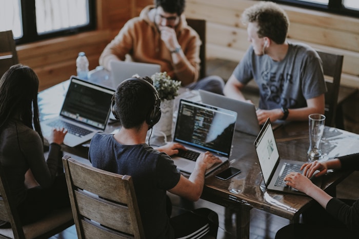 Freelance marketers collaborating over laptop
